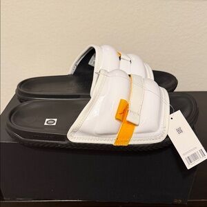 NIKE Jordan Super Play Slide in White, Taxi-Black, and Fire Red